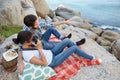 Romantic couple, during a picnic on the rocks