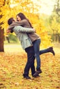 Romantic couple playing in the autumn park Royalty Free Stock Photo