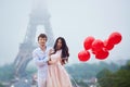 Romantic couple with red balloons together in Paris Royalty Free Stock Photo