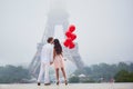 Romantic couple with red balloons together in Paris Royalty Free Stock Photo