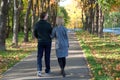 Romantic couple relaxing in autumn park, cuddling, enjoying fresh air, beautiful nature, nice fall weather. Beloved Royalty Free Stock Photo