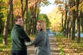 Romantic couple relaxing in autumn park, cuddling, enjoying fresh air, beautiful nature, nice fall weather. Beloved Royalty Free Stock Photo