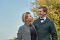 Romantic couple relaxing in autumn park, cuddling, kissing, enjoying fresh air, beautiful nature, nice fall weather Royalty Free Stock Photo