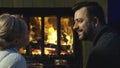 Romantic couple relaxing in front of a fire