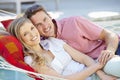 Romantic Couple Relaxing In Garden Hammock Together Royalty Free Stock Photo