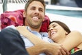 Romantic Couple Relaxing In Garden Hammock Together Royalty Free Stock Photo