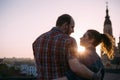 Romantic couple on roof in focus on foreground