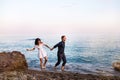 Romantic couple in the sea water have fun together.