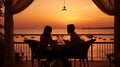 romantic couple sit in restaurant at sunset sea Royalty Free Stock Photo