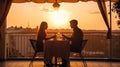 romantic couple sit in restaurant at sunset sea Royalty Free Stock Photo