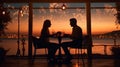 romantic couple sit in restaurant at sunset sea Royalty Free Stock Photo