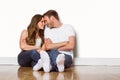 Romantic couple sitting on floor Royalty Free Stock Photo