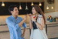 Romantic couple standing in front coffee shop smile By the girl holding a cup of ice cream Royalty Free Stock Photo