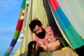 Romantic couple in tent camping on nature background. Adventure for young friends on summer day. Hipster couple tender Royalty Free Stock Photo