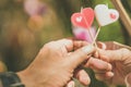 Happy joyful couple give heart candle to each other in the afternoon, Love concept