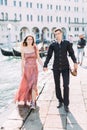 Romantic couple in Venice happy together and walking. Italy, Europe. Royalty Free Stock Photo