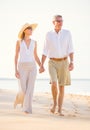 Romantic Couple Walking on the Beach Royalty Free Stock Photo