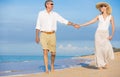 Romantic Couple Walking on the Beach Royalty Free Stock Photo