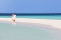 Romantic Couple Walking On Beautiful Tropical Beach Royalty Free Stock Photo