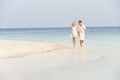 Romantic Couple Walking On Beautiful Tropical Beach Royalty Free Stock Photo