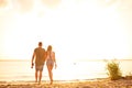 Romantic couple walking over beach during date Royalty Free Stock Photo