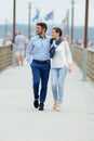 Romantic couple walking on pier nea sea Royalty Free Stock Photo