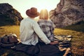 Romantic couple watching sunset in mountains Royalty Free Stock Photo