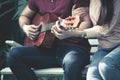 Romantic couples playing guitar together