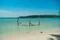 Tropical chilling out hammock in turquoise water in Thailand. Relax vacation leisure lifestyle on exotic tropical island beach, Royalty Free Stock Photo