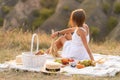 A romantic date with a beautiful girl. An evening picnic in a picturesque, uninhabited place