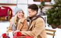 Romantic Date At Camping. Loving Couple Drinking Tea Outdoors At Winter Campsite Royalty Free Stock Photo