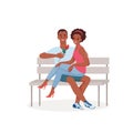 Romantic date couple in love in park, happy young man woman lovers sitting on bench Royalty Free Stock Photo