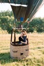 Romantic date, marriage proposal, engagement, wedding anniversary concept. Couple in love sitting in the basket of hot Royalty Free Stock Photo