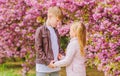 Romantic date in park. Spring time to fall in love. Kids in love pink cherry blossom. Love is in the air. Couple