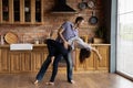 Young couple having date indoors dancing passionate disco at kitchen Royalty Free Stock Photo