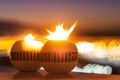 Romantic decorative candles burning outdoors with the street lights glowing on the background