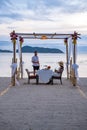 Romantic dinner on the beach, couple man and woman mid age having a romantic dinner on the beach in Phuket Thailand Royalty Free Stock Photo