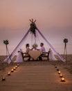 Romantic dinner on the beach, honemoon dinner on the beach during sunset Thailand, valentine setting