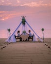 Romantic dinner on the beach, honemoon dinner on the beach during sunset Thailand, valentine setting