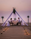 Romantic dinner on the beach, honemoon dinner on the beach during sunset Thailand, valentine setting Royalty Free Stock Photo