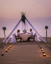 Romantic dinner on the beach, honemoon dinner on the beach during sunset Thailand, valentine setting