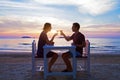 Romantic dinner on the beach in luxury restaurant Royalty Free Stock Photo