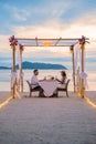 Romantic dinner on the beach in Phuket Thailand, couple man and woman having dinner on the beach Royalty Free Stock Photo