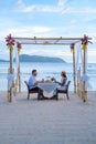 Romantic dinner on the beach in Phuket Thailand, couple man and woman having dinner on the beach Royalty Free Stock Photo