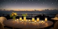 Romantic dinner on the beach by the sea. Wooden table with candles and flowers in a vase on the beach. .Candles and flowers on a Royalty Free Stock Photo