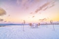 Amazing romantic dinner on the beach on wooden deck with candles under sunset sky. Romance and love, luxury destination dinning Royalty Free Stock Photo