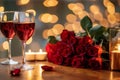 Romantic Dinner. Bouquet of flowers lying on the table, selective focus on bunch of roses, two glasses of red wine and candles on Royalty Free Stock Photo