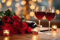 Romantic Dinner. Bouquet of flowers lying on the table, selective focus on bunch of roses, two glasses of red wine and candles on Royalty Free Stock Photo