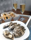 Romantic dinner for a couple, fresh oysters, champagne and sushi