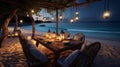 Romantic dinner setting on the beach at sunset